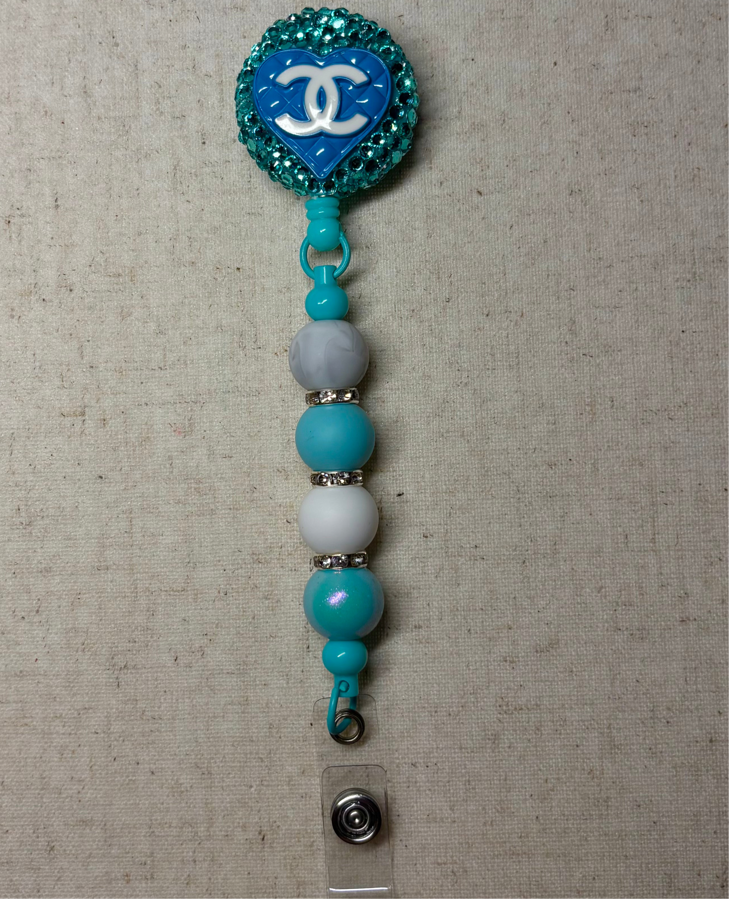Designer Chanel badge reel