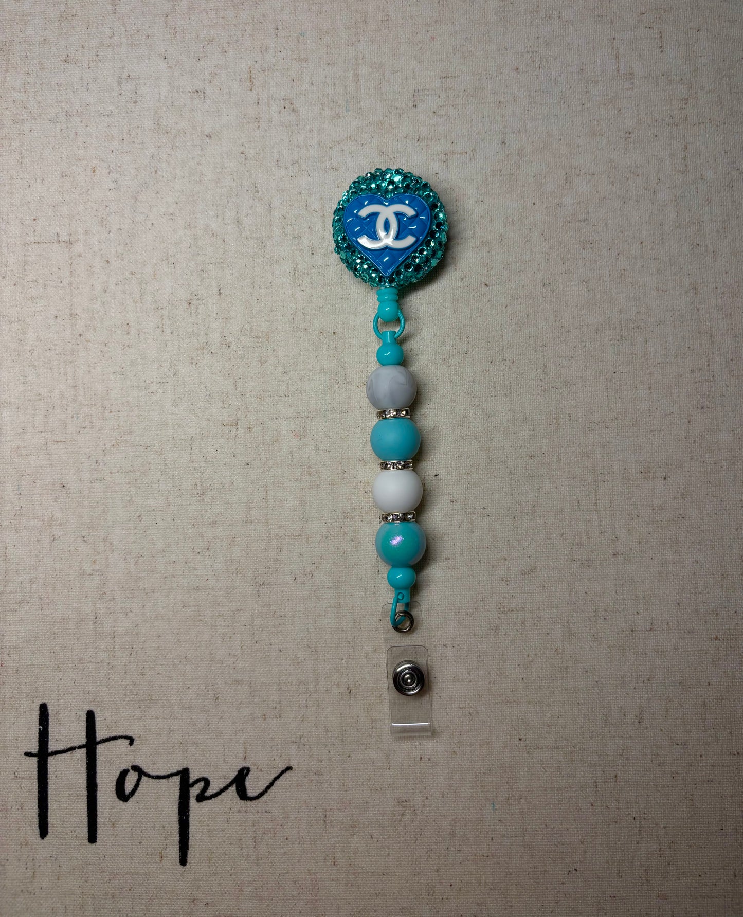 Designer Chanel badge reel